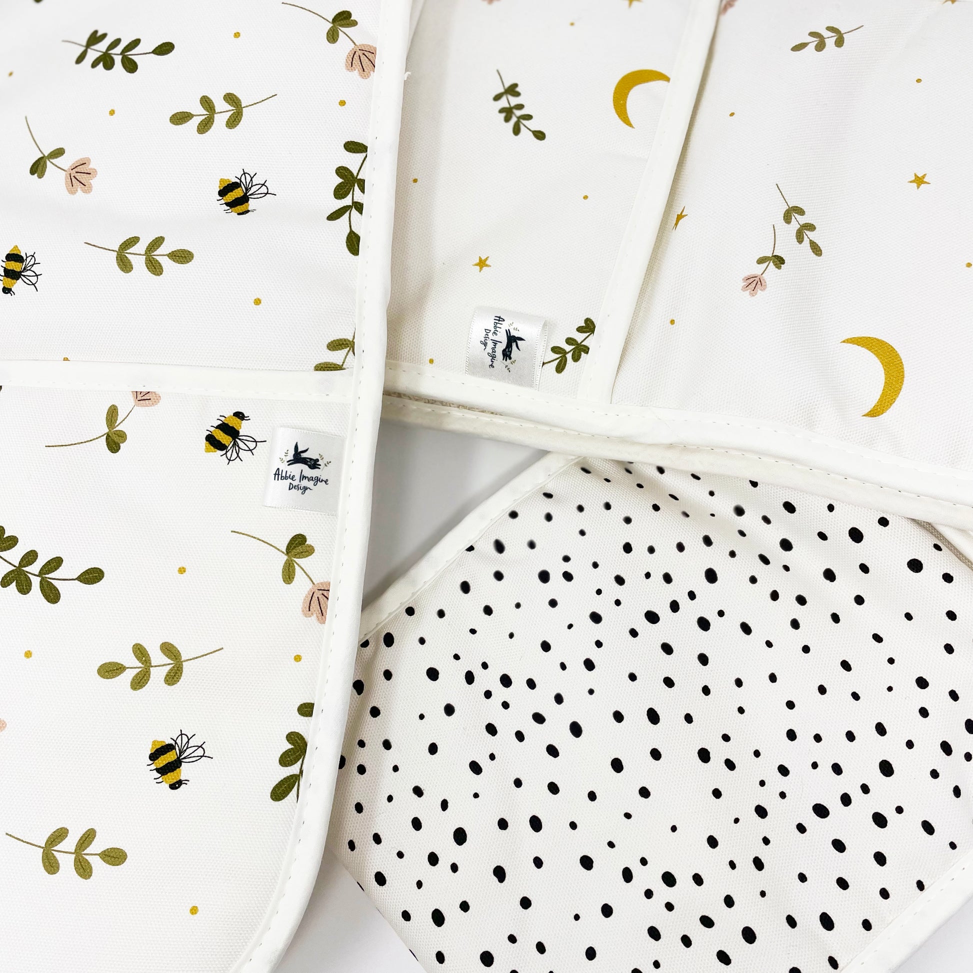 Close up of polka dot, bees and moons oven gloves by Abbie Imagine